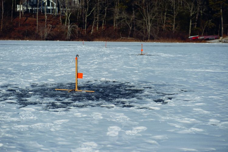 Some anglers fish several ice tip-ups simultaneously to increase their odds of hooking up.