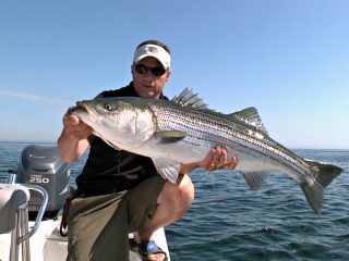 Chris Megan with striped bass